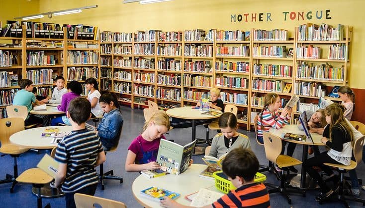 Library reading hall with bookshelves